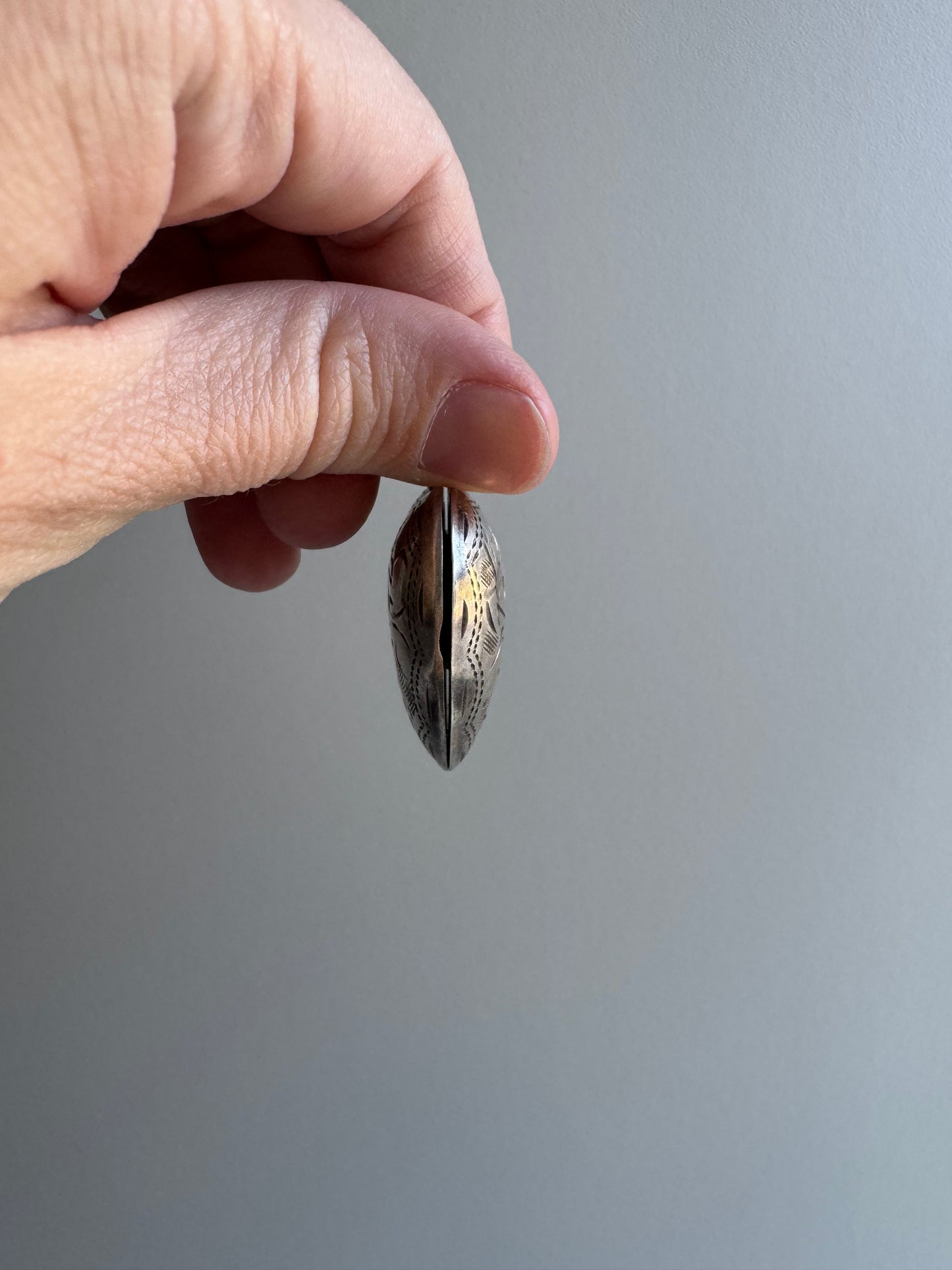 LIKE A LIVE // short term discounted price / sterling silver dented oversized engraved heart locket