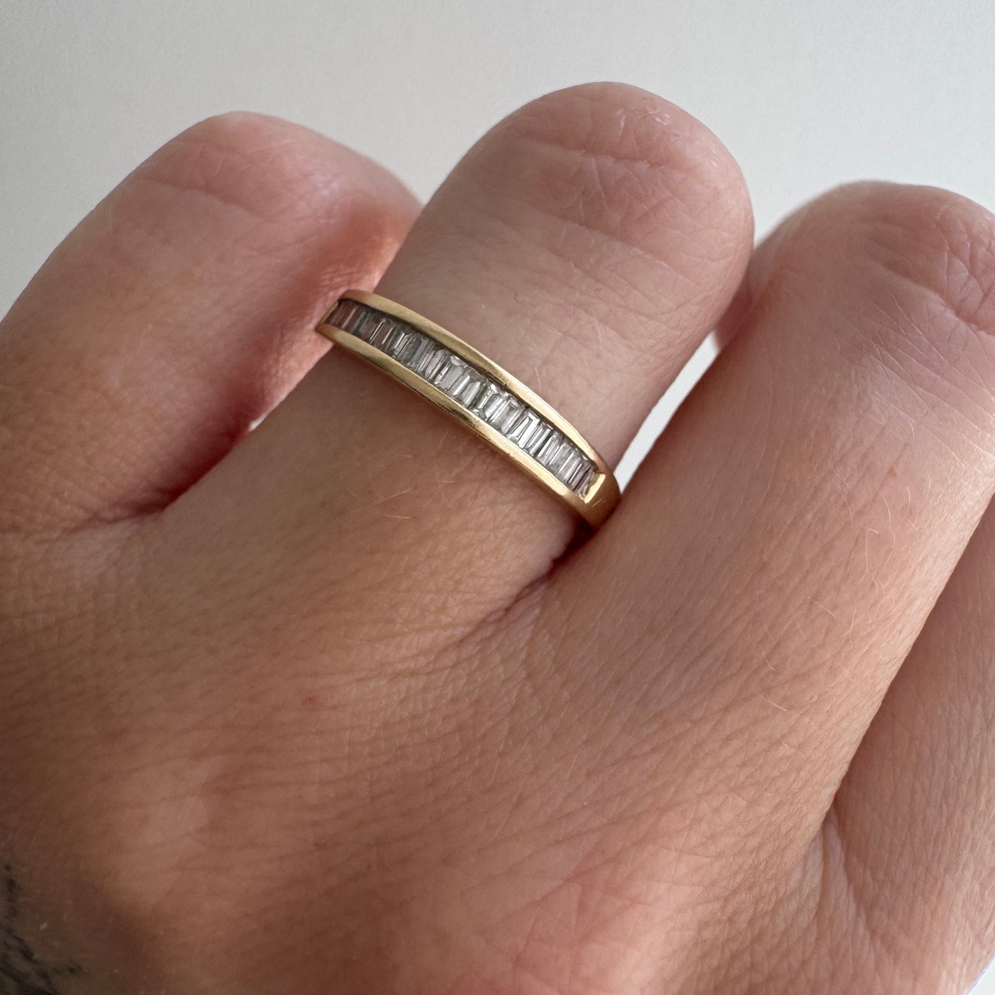 V I N T A G E // sparkle geometry / 14k yellow gold and channel set baguette diamond half eternity band / size 5.75