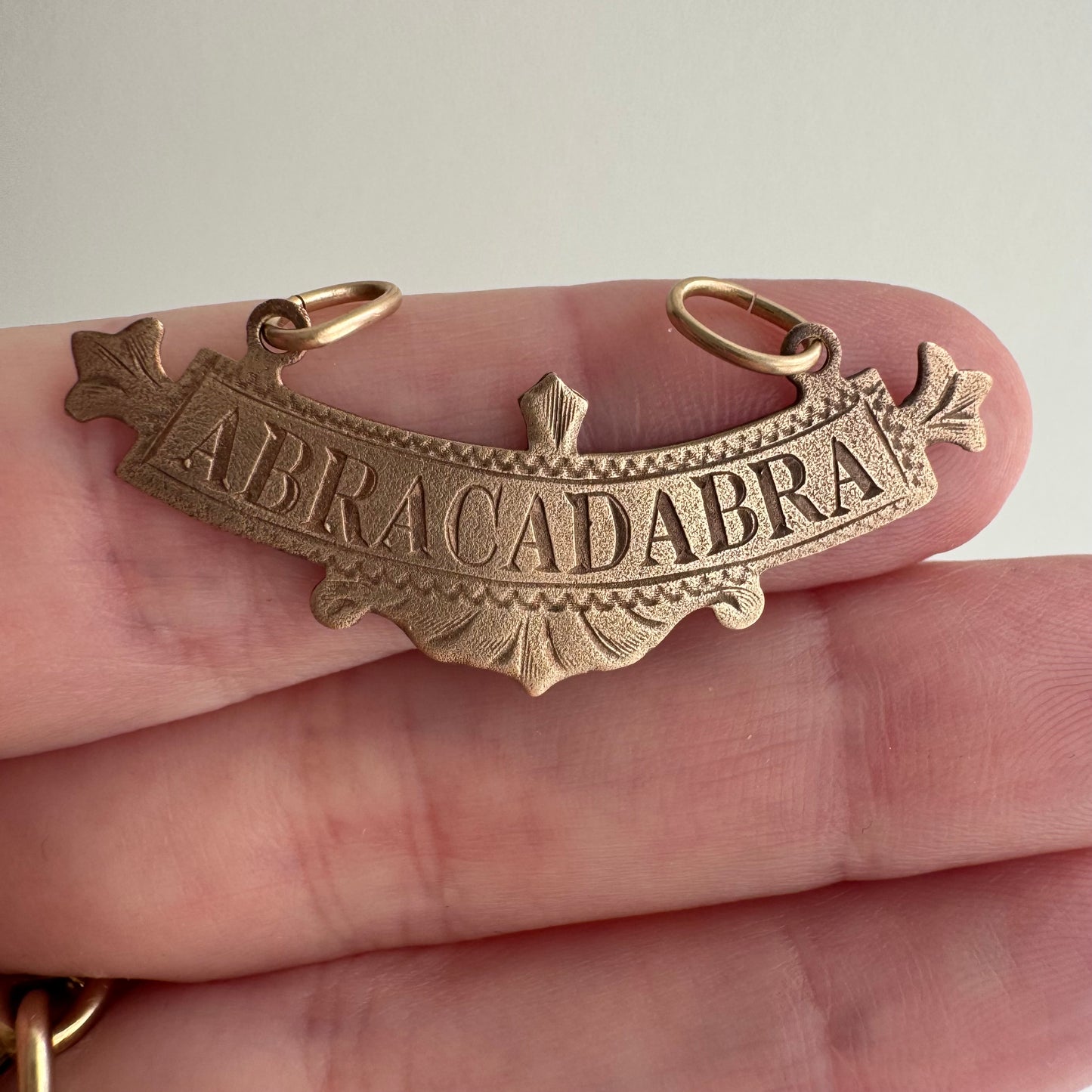 N E W // abracadabra / 10k rosy gold abracadabra / a pendant