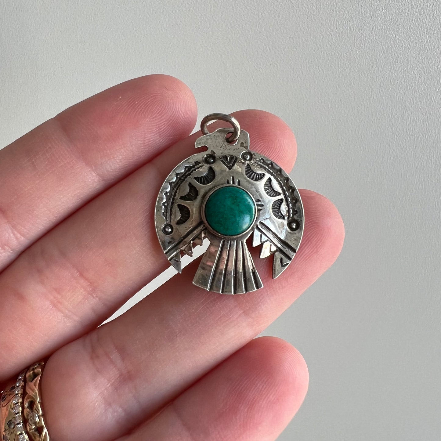 V I N T A G E // thunderbird hug / sterling silver and azurmalachite stamped thunderbird pendant