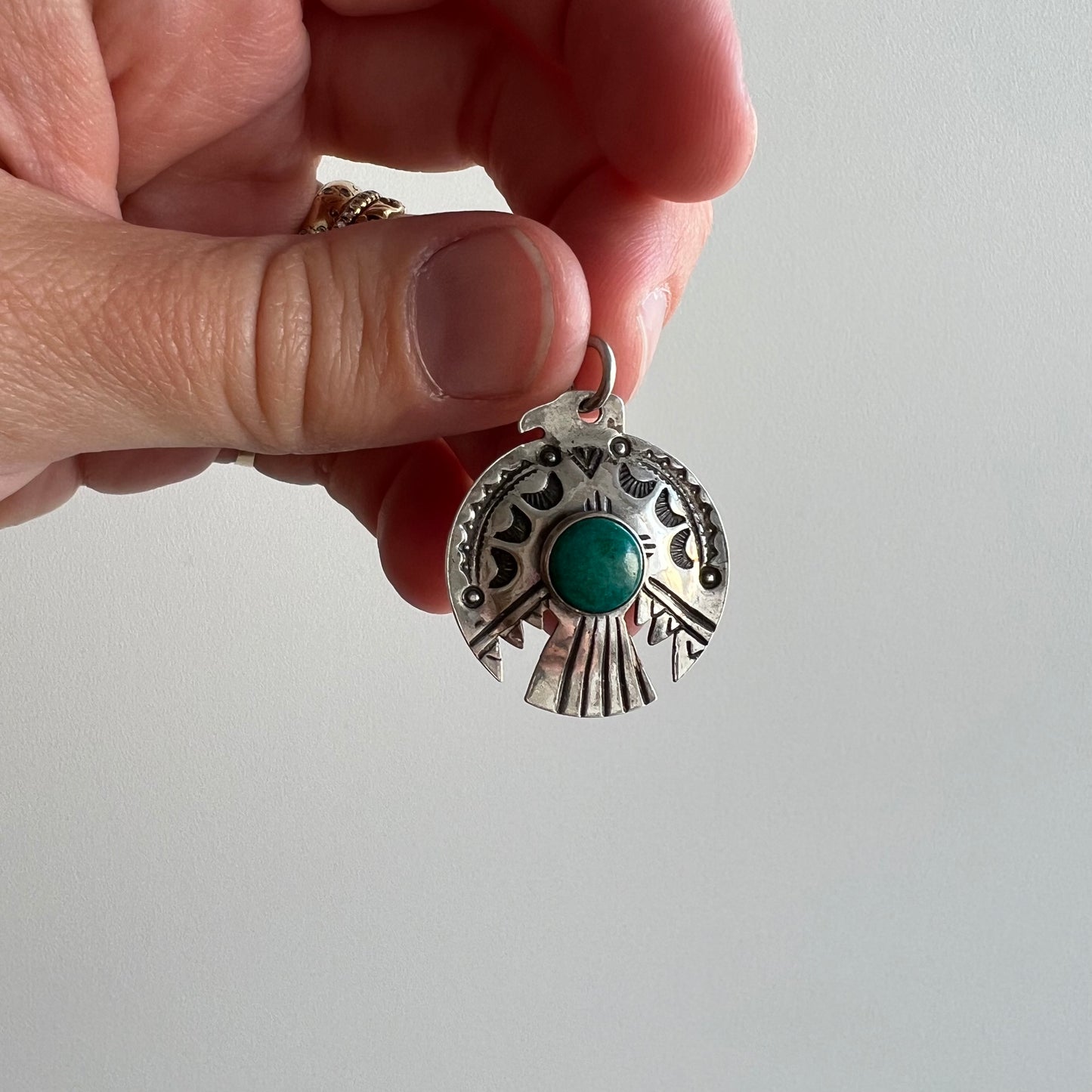 V I N T A G E // thunderbird hug / sterling silver and azurmalachite stamped thunderbird pendant