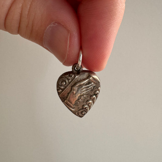 RESERVED V I N T A G E // your hand in mine / sterling silver puffy heart with handshake motif / a charm or pendant