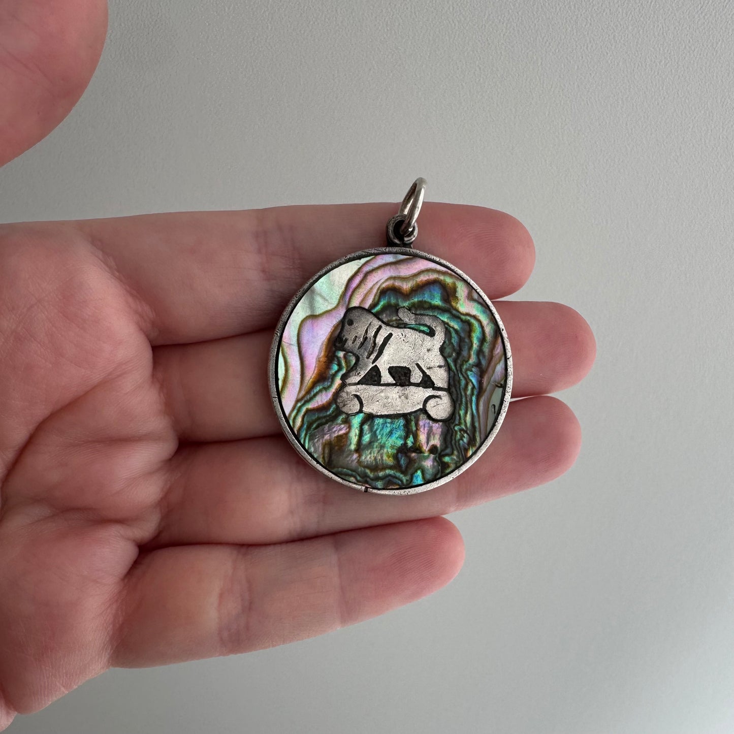 V I N T A G E // psychedelic skateboarding foo dog lion / sterling silver and abalone / a pendant