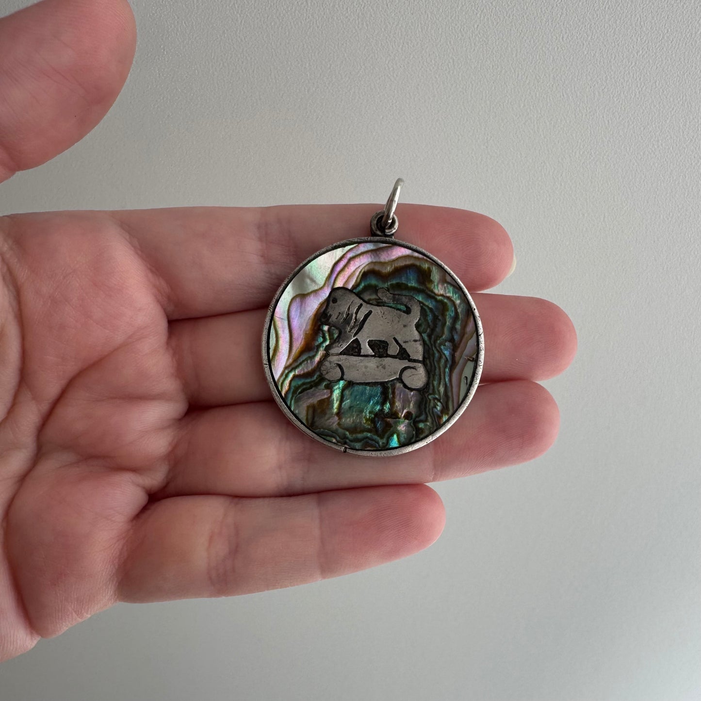 V I N T A G E // psychedelic skateboarding foo dog lion / sterling silver and abalone / a pendant