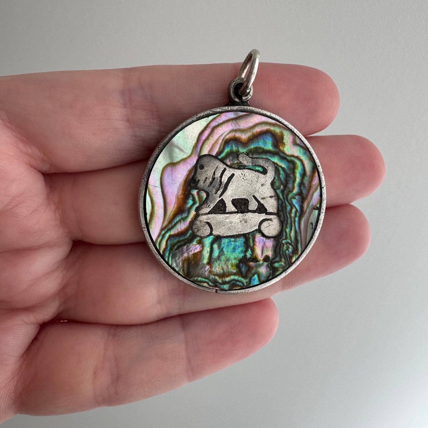 V I N T A G E // psychedelic skateboarding foo dog lion / sterling silver and abalone / a pendant