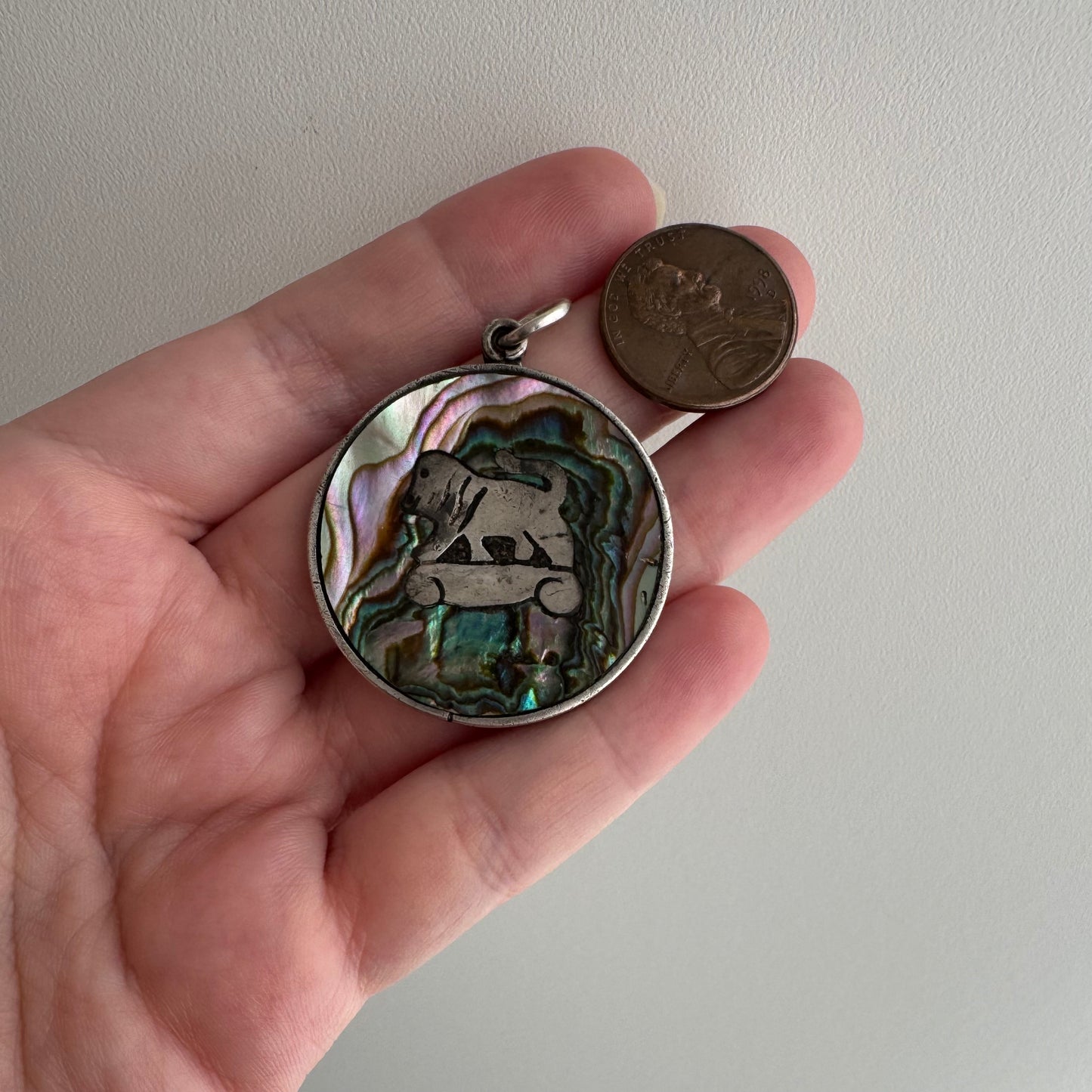 V I N T A G E // psychedelic skateboarding foo dog lion / sterling silver and abalone / a pendant