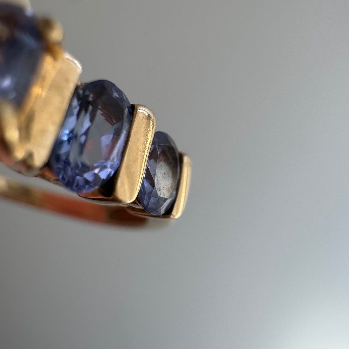 V I N T A G E // periwinkle row / 10k yellow gold and tanzanite half eternity band / size 8