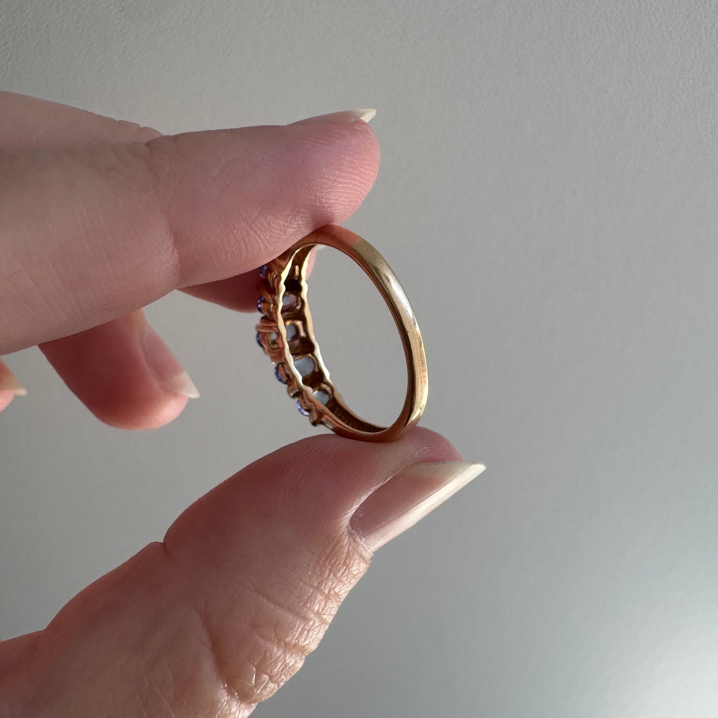 V I N T A G E // periwinkle row / 10k yellow gold and tanzanite half eternity band / size 8