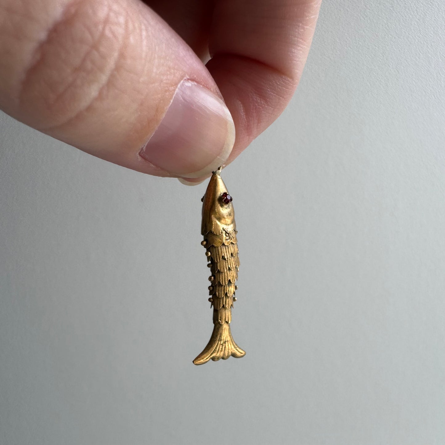 V I N T A G E // a lucky catch / 9k yellow gold and red glass articulated wiggle fish / a pendant