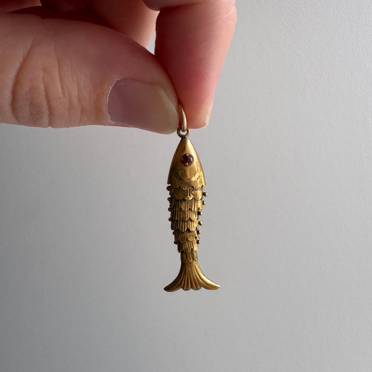 V I N T A G E // a lucky catch / 9k yellow gold and red glass articulated wiggle fish / a pendant