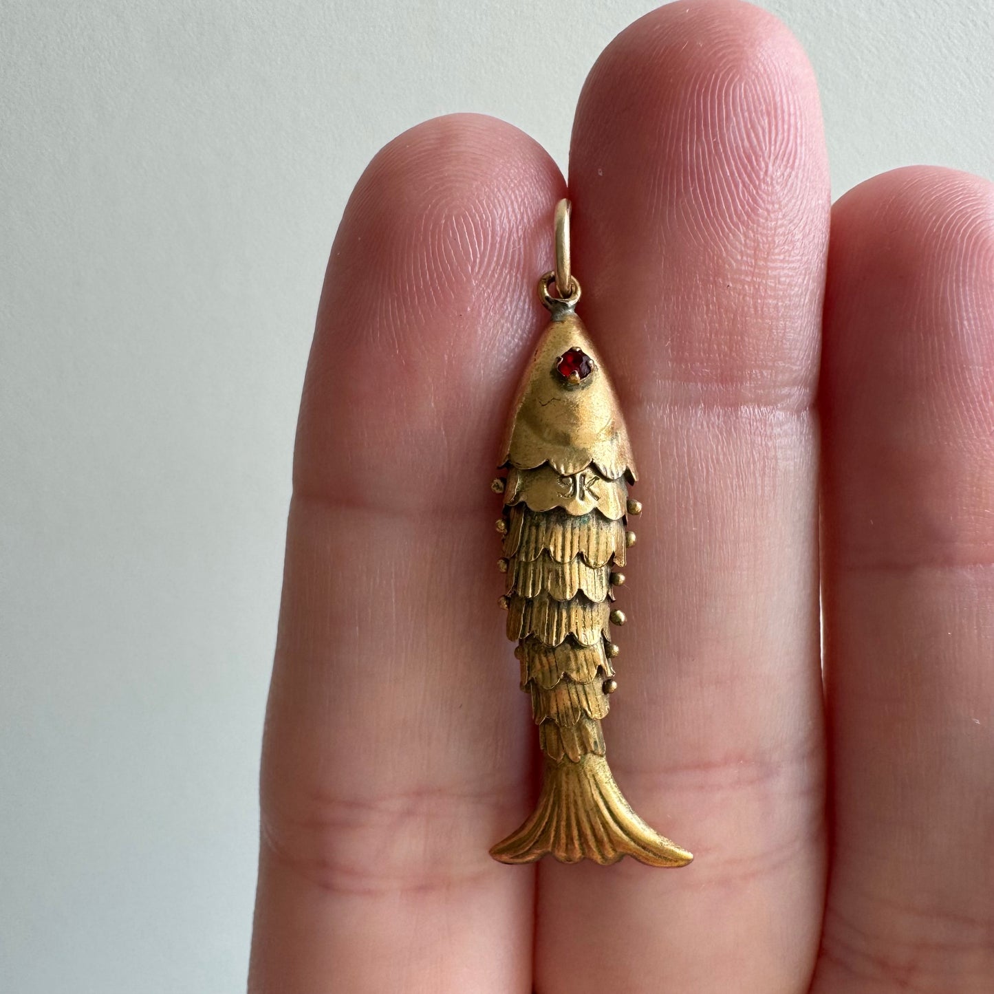 V I N T A G E // a lucky catch / 9k yellow gold and red glass articulated wiggle fish / a pendant