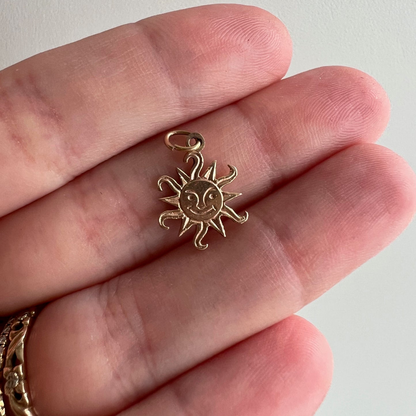 V I N T A G E // flares of mischief / 14k yellow gold sun face charm