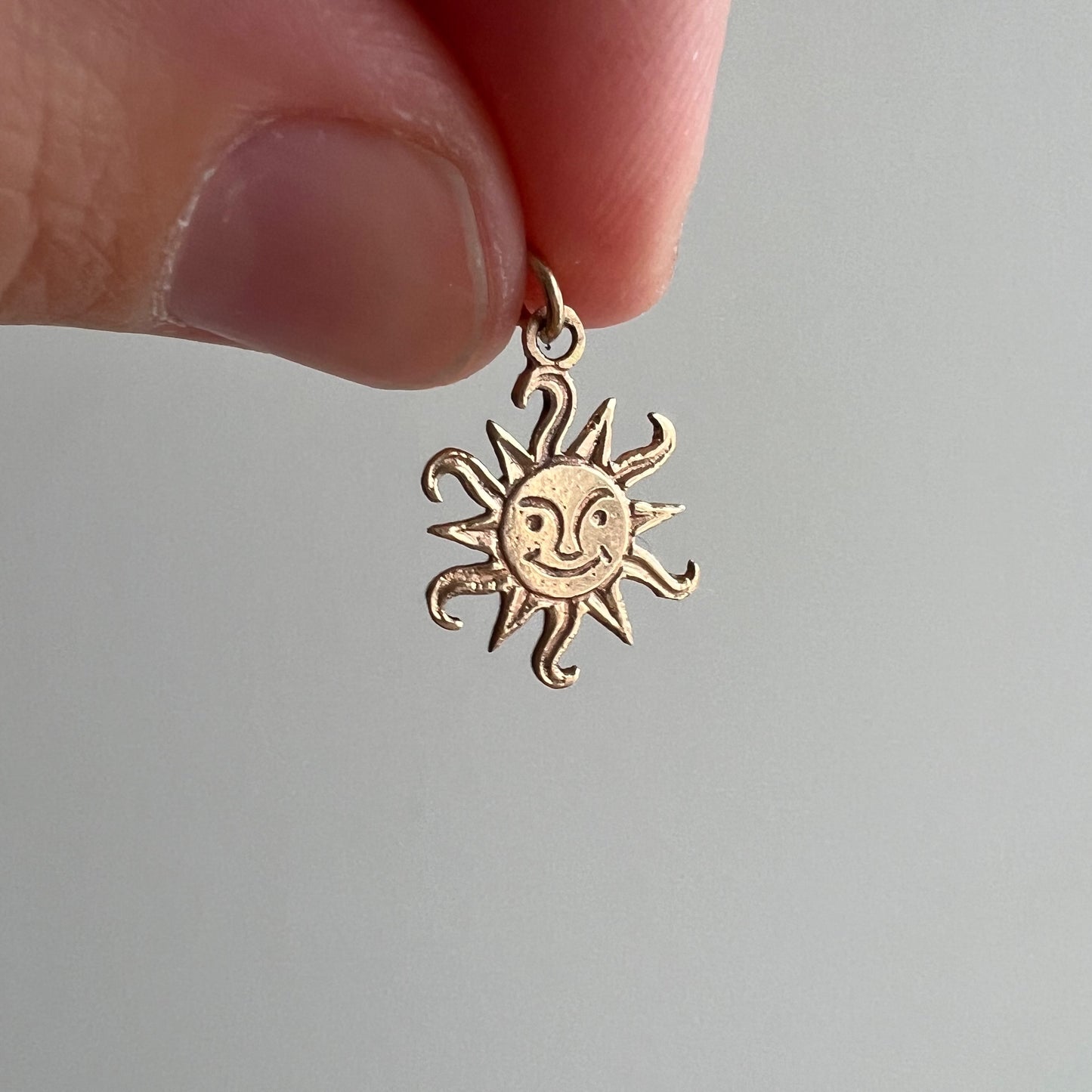 V I N T A G E // flares of mischief / 14k yellow gold sun face charm