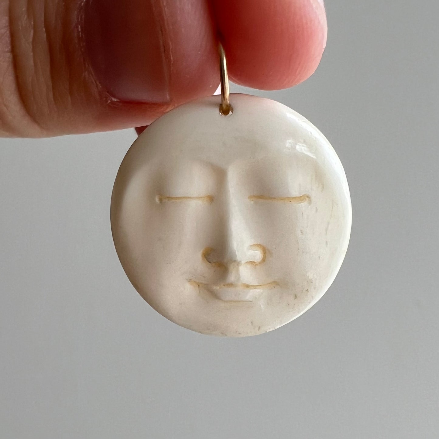 V I N T A G E // tranquil moon / carved bone moon face with a 14k bail / a pendant