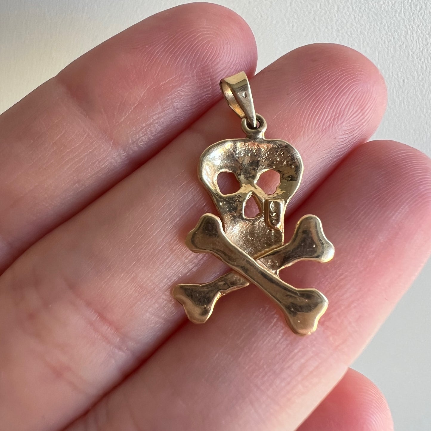 V I N T A G E // of life and beyond / 14k yellow gold memento mori skull and crossbones pendant