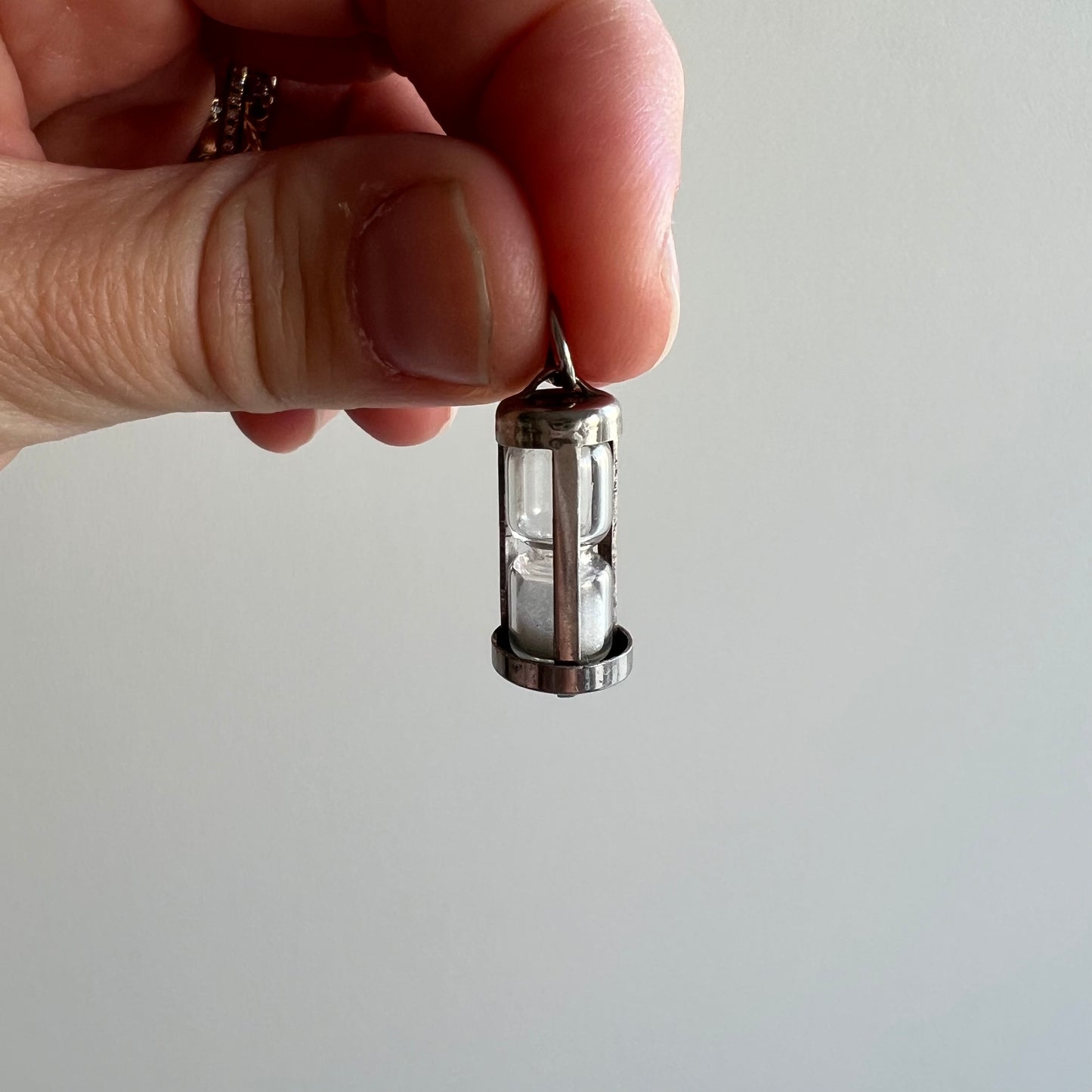 V I N T A G E // quickest kiss / sterling silver hourglass pendant charm